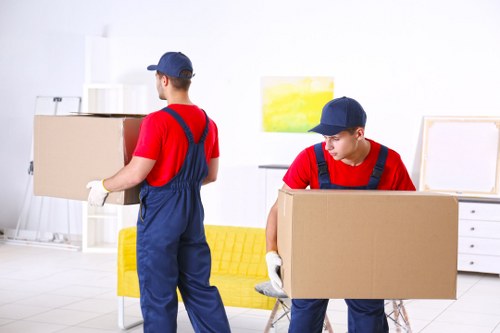 Removal team preparing belongings with safety equipment