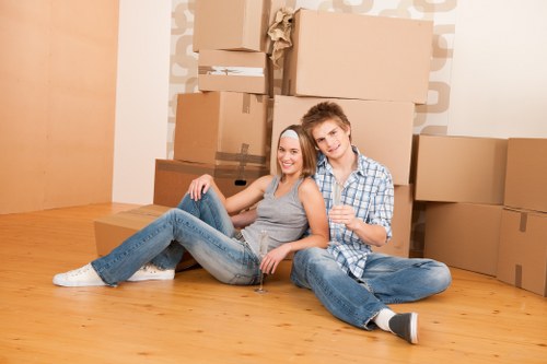 Moving boxes and furniture in a Notting Hill residential street