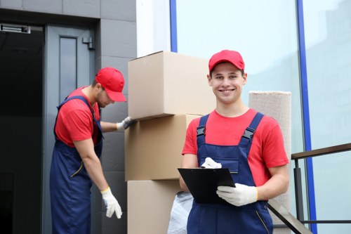 Removal van and moving team on a Notting Hill street