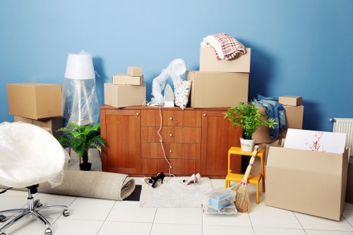 Professional house removalists loading furniture for a Notting Hill home move