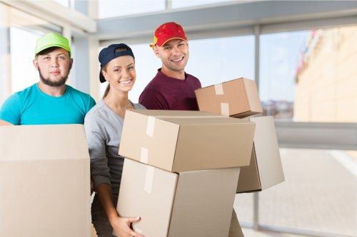 Moving boxes and furniture in a Notting Hill property