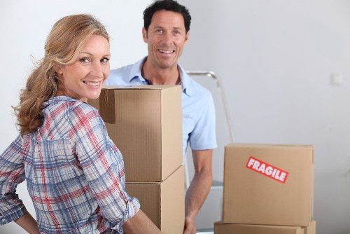 Professional movers handling furniture in a Nottinghill property