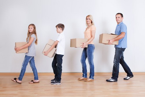 Local movers transporting boxes near Notting Hill homes