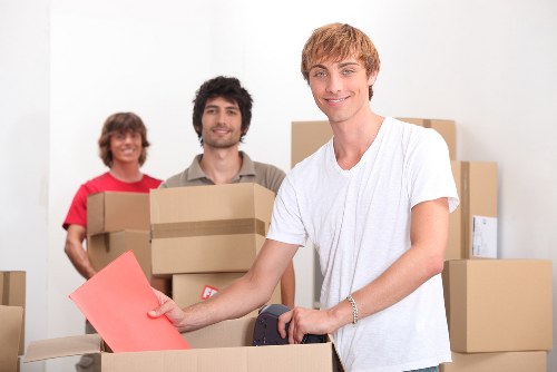 Careful packing of fragile household items for removal services