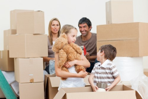 Professional movers handling furniture in a Notting Hill property